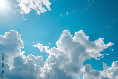 The photo captures a stunning blue sky filled with numerous fluffy white clouds, A view of spacious white clouds in a bright blue sky, AI Generated