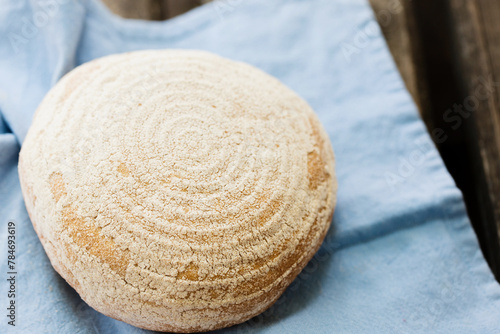 A round loaf of bread on a napkin