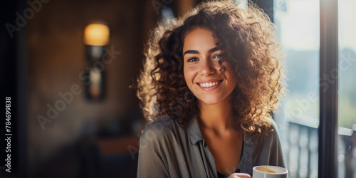 Radiant Smiling Young Woman Enjoying Morning Coffee Indoors
