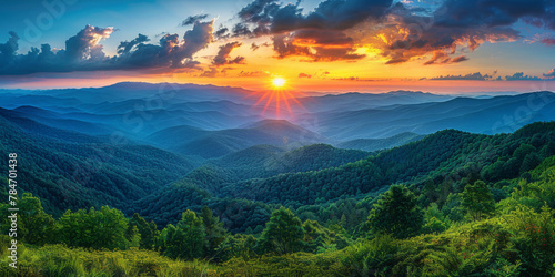 Breathtaking Sunset Over Lush Green Mountainous Landscape © smth.design