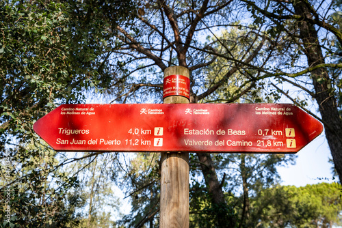 Camino Natural de Los Molinos de Agua - way marker showing direction and distances to several locations, province of Huelva, Andalusia, Spain