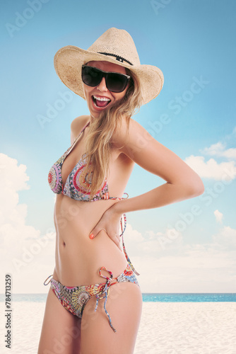 A smiling young woman in a patterned bikini poses on a sunny beach against a blue sky and sea