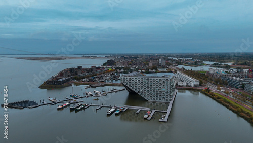 Aerial drone view of Sluishuis modern residential complex on the water Amsterdam Netherlands photo
