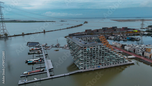Aerial drone view of Sluishuis modern residential complex on the water Amsterdam Netherlands photo