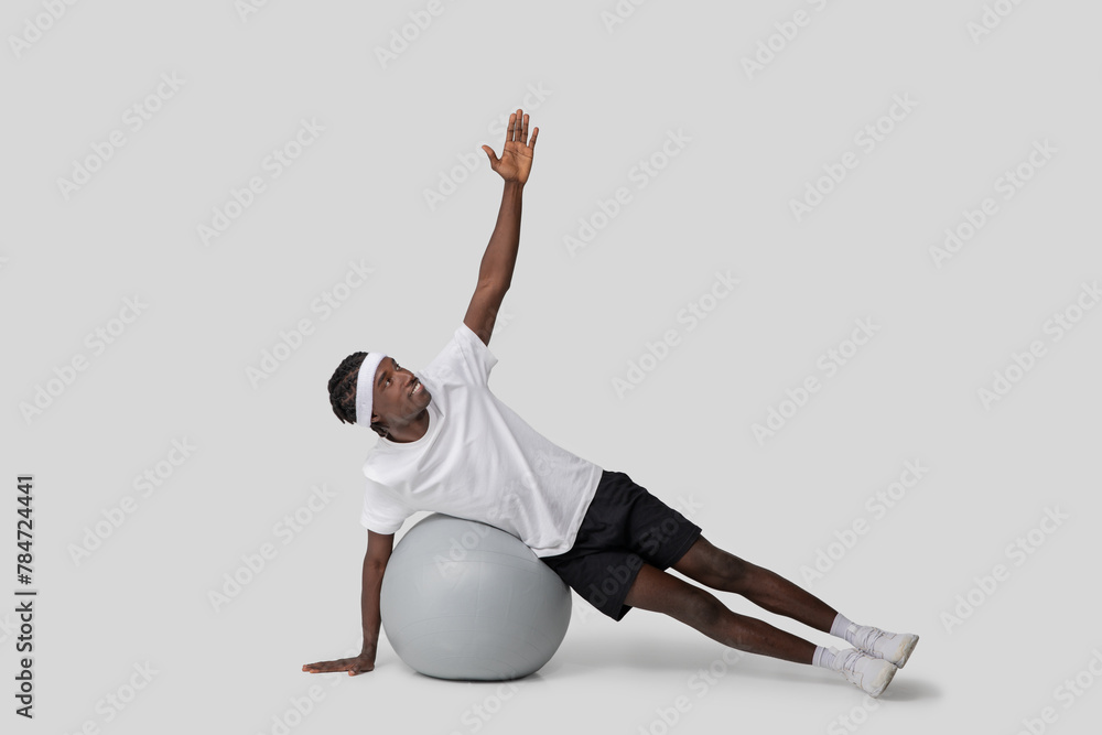 Side plank exercise on a fitness ball