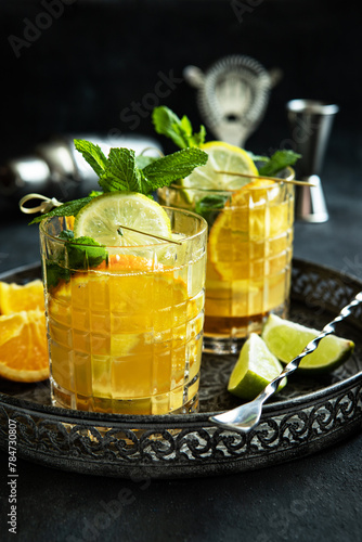 Summer   citrus cold drink (juice,  lemonade, cocktail) with  mint