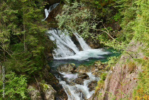 Beautiful mountain forest waterfall in the Tatra Mountains.