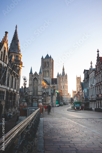 Well-known Ghent city centre with a view of the Belfry of Ghent at sunrise, three towers symbolizing this city. The Golden Hour