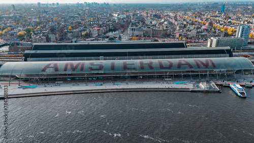 Canvas Print Aerial drone view Amsterdam Central Train Station with Amsterdam sign on roof