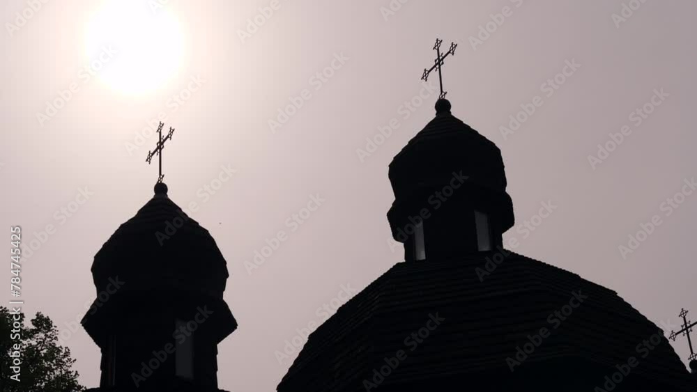 silhouette of domes with crosses of a wooden church silhouette of domes with crosses of a wooden church
