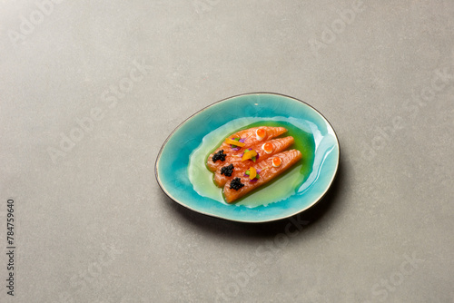 Gourmet meal salmon with caviar and green oil © 26max