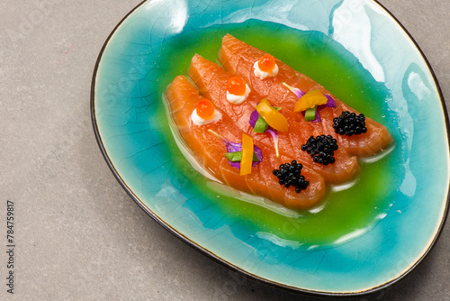 Gourmet meal salmon with caviar and green oil © 26max