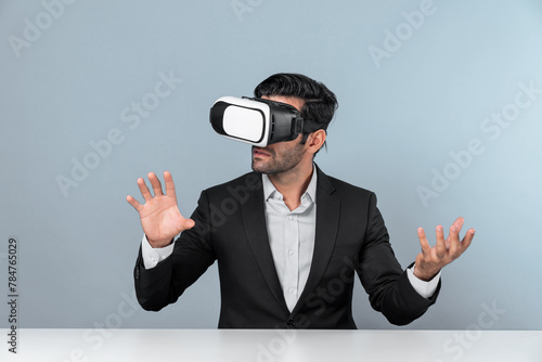 Smart businessman sitting while pointing and choosing data analysis by using technology innovation. Professional caucasian project manager using virtual reality glasses and VR goggles. Deviation.