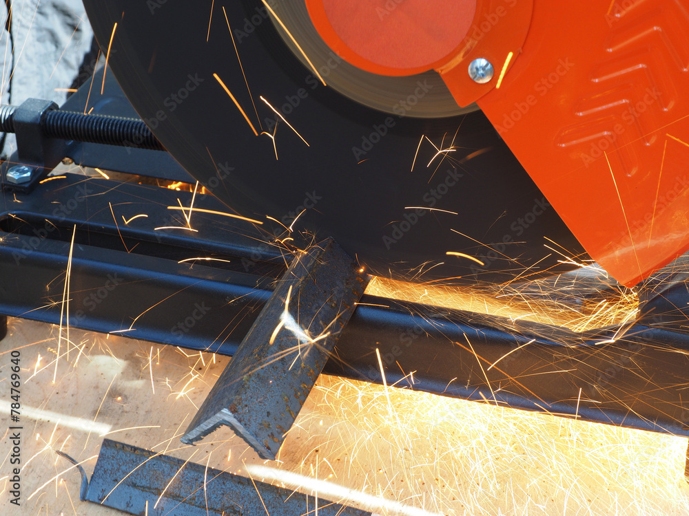 Sparks from cutting metal with angle grinder. Sparks while grinding iron.
The concept of locksmith work, processing of metal products.
