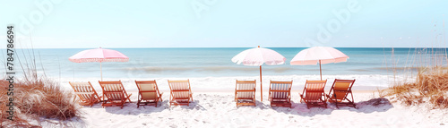 Tropical beach with the retro deckchairs and umbrellas photo