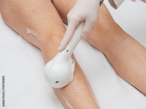 Beautician Removing Hair Of Young Woman’s body