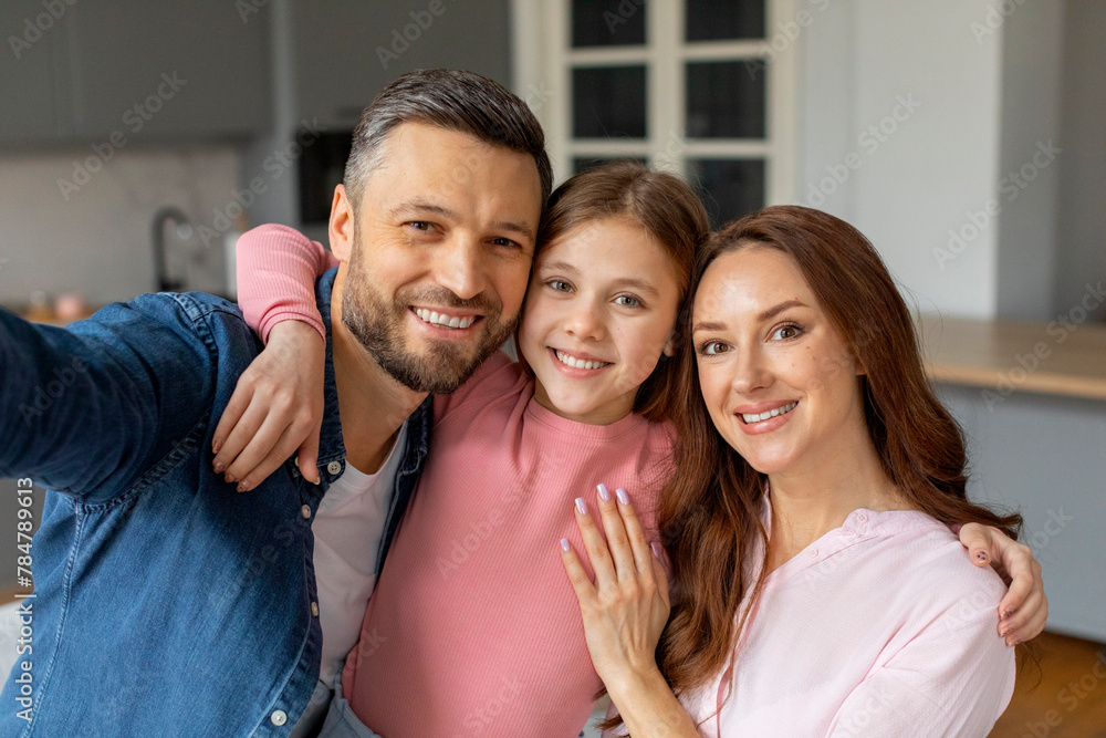 Happy family posing together in their home Happy family posing together in their home