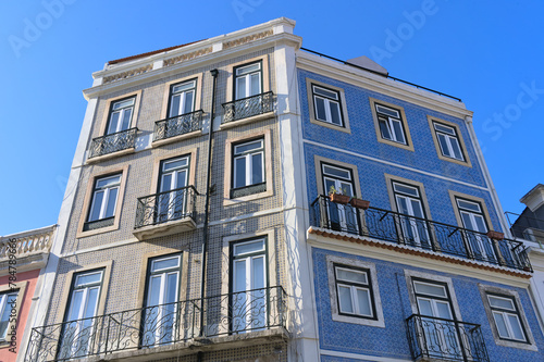 facade with blue tiles of an building with windows in Lisbon, Portugal