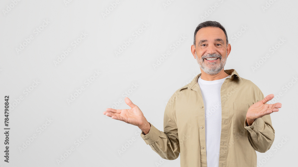 Smiling senior man with open hands gesture Smiling senior man with open hands gesture