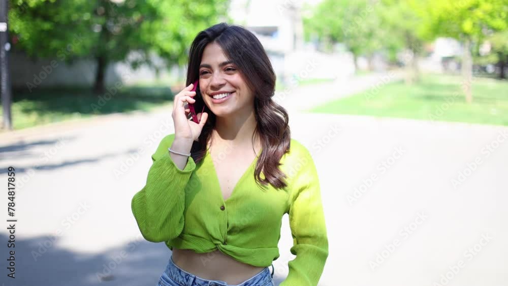 Young Mexican woman telephoning and enjoying outdoors Young Mexican woman telephoning and enjoying outdoors