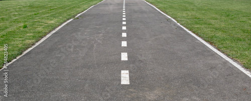 empty airport runway, asphalt with white lines