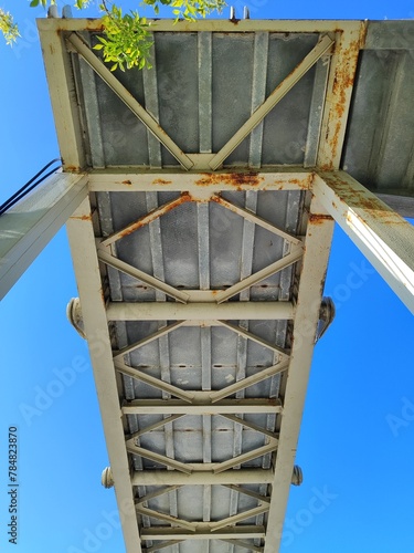 Metal overpass built on the highway for pedestrians from bottom side view