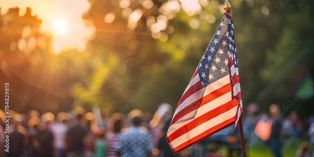 Patriotic scene with the US flag over a bokeh background of people. Memorial Day, copy space, banner, - obrazy, fototapety, plakaty 