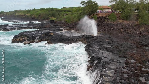 KAUAI - 3.19.2024 - Amazing aerial footage circling the Spouting Horn blowhole on the coast of Kauai, Hawaii.
