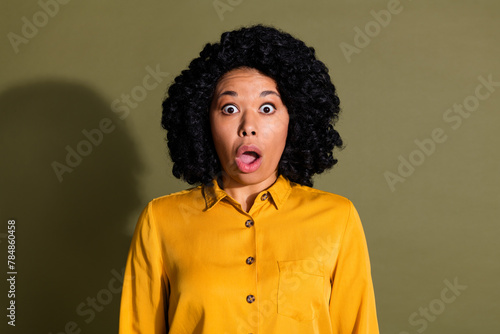 Portrait of nice young woman open mouth wear yellow shirt isolated on khaki color background