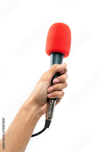 Man hand holding a microphone with red sponge on head isolated on white background. photo