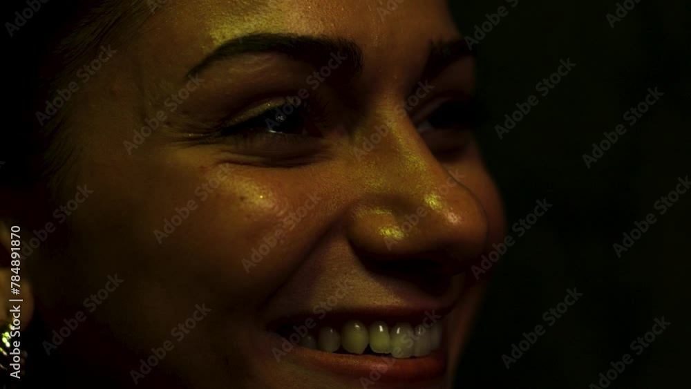 Young woman laughs at a screen Young woman laughs at a screen
