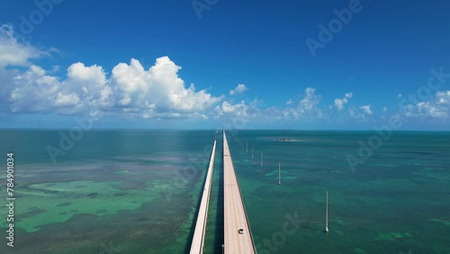 Aerial Epic Bridge Over Ocean. Seven Mile Bridge Florida Keys Drone Flight Cars Driving on Bridge Bright Daylight photo