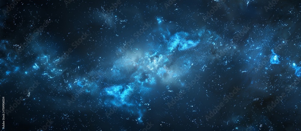 Fototapeta premium A stunning depiction of a deep blue galaxy filled with twinkling stars set against a pitch-black background, creating a mesmerizing celestial scene