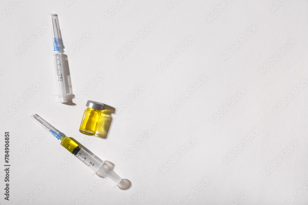 Medical syringes and ampoule on white background Medical syringes and ampoule on white background