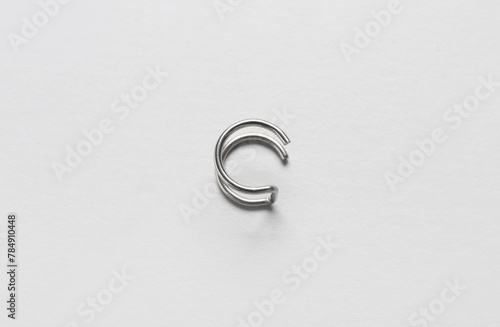 Double wire ear cuff cartilage helix earring on white background © Pixel-Shot