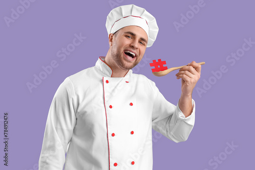 Male chef with spoon and ha...