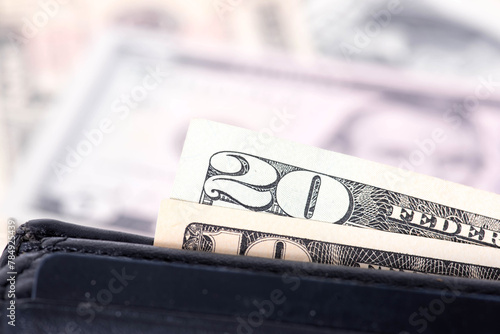 Wallet and close-up of dollar bills