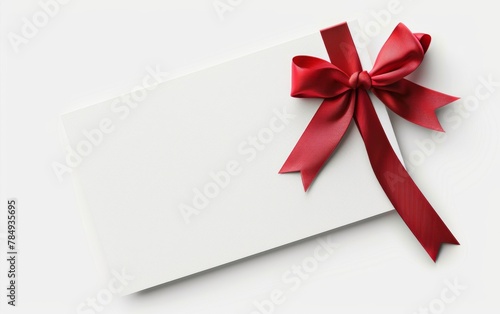 close up of a note card with ribbon bow on white background