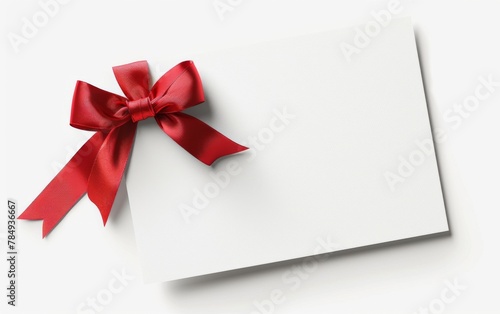 close up of a note card with ribbon bow on white background © MUS_GRAPHIC