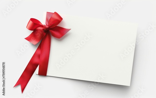 close up of a note card with ribbon bow on white background