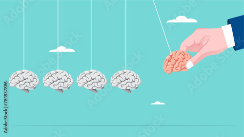 knowledge sharing to inspire the team, Coaching teams to achieve business success or achieve target, businessman hand pull smart human brain as pendulum to transfer knowledge to empty human brain