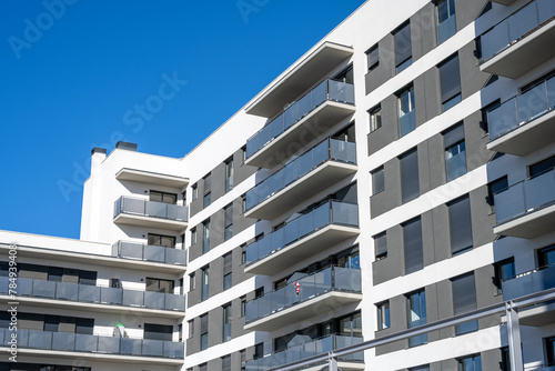 New white apartment building with balconies seen in Barcelona, Spain