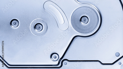 closeup view of hard drive lid. brushed metal texture. industrial background.