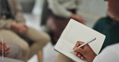 Psychologist, hands and writing in therapy or closeup for group consultation, support and helping for mental health. Therapist, pen and book for review, feedback and patient information in counseling