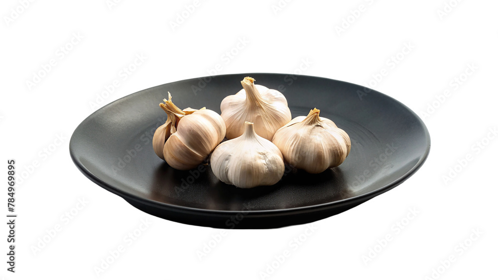 Garlics on black plate isolated on transparent background Garlics on black plate isolated on transparent background