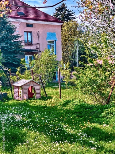 Obraz na płótnie A beautiful fragment of a small garden in Jaslo, Poland. w salonie