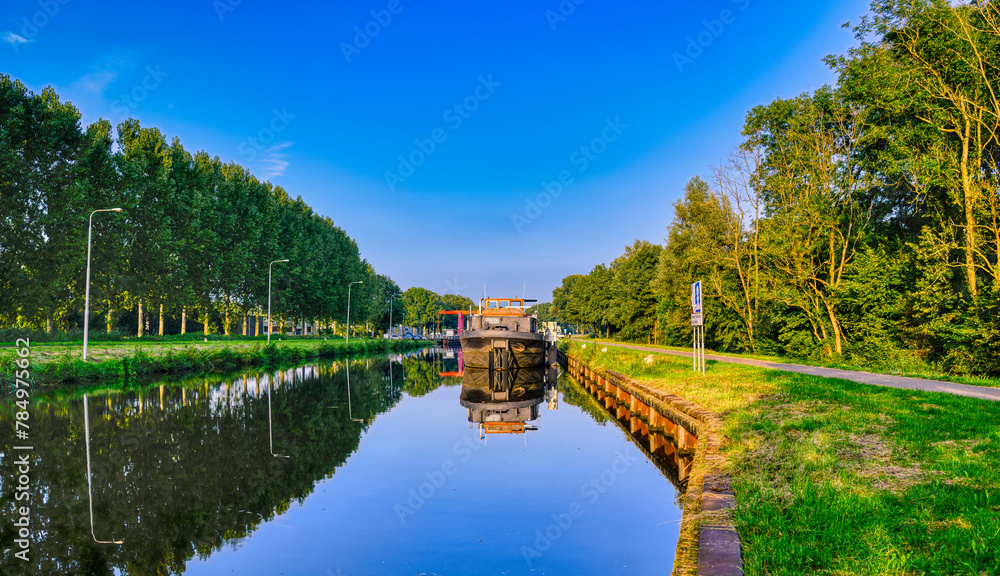 A ship docked at the Wilhelminakanaal canal near the village of Beek en Donk, The Netherlands. A ship docked at the Wilhelminakanaal canal near the village of Beek en Donk, The Netherlands.