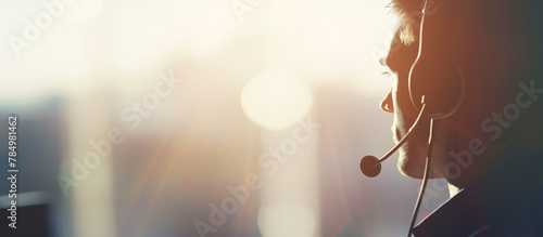 Silhouette of a man with a headset, suggestive of customer service, against a light, bright background, concept of communication. Generative AI photo