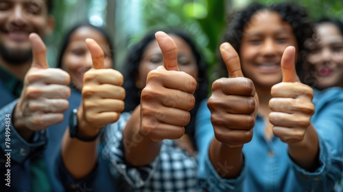 portrait of business people giving thumbs up