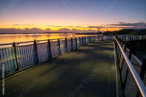 Coastal walkway bridge at sunrise / blue hour photo